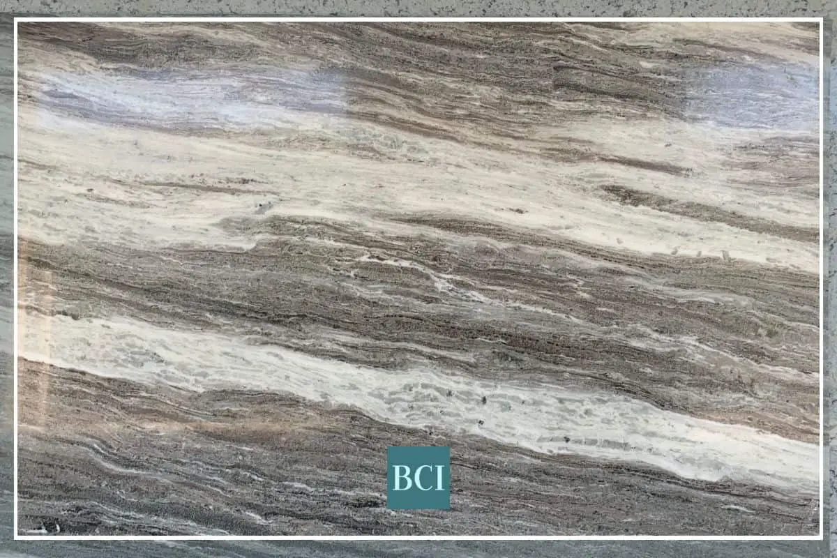 Photo of grey, tan and cream granite kitchen countertop slab. 